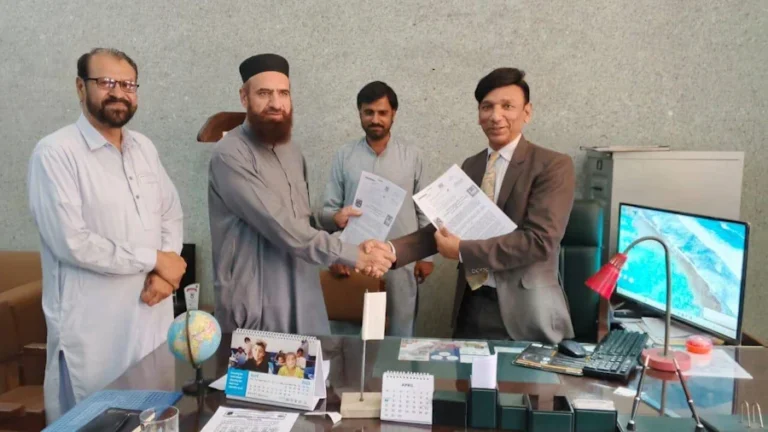 Principal GCT Rajanpur and IRP representative are shaking hands after signing MoU